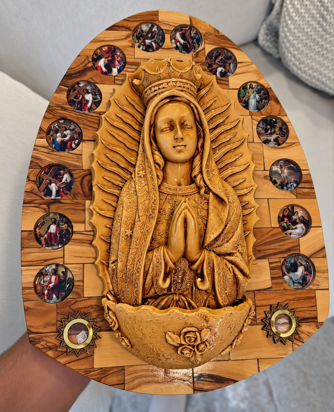 Our Lady of Guadalupe olive wood wall plaque with a crowned praying Mary relief surrounded by colorful Stations of the Cross medallions