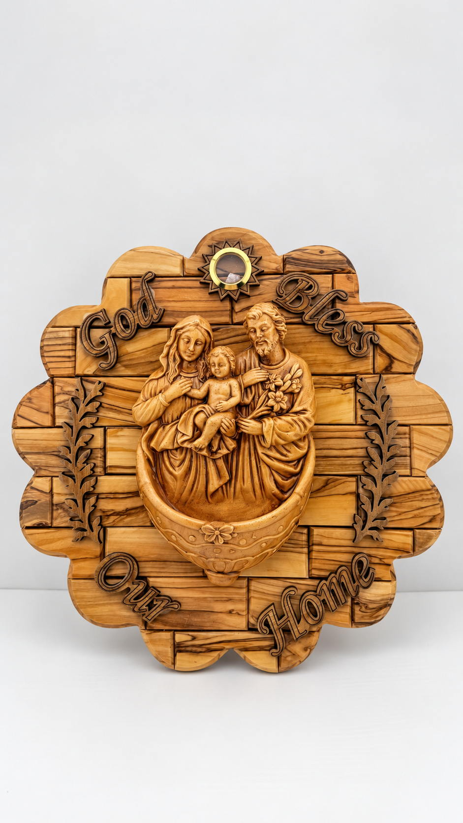 Olive wood Holy Family wall hanging with Mary, Joseph, and Jesus, decorative branches, and God Bless Our Home lettering