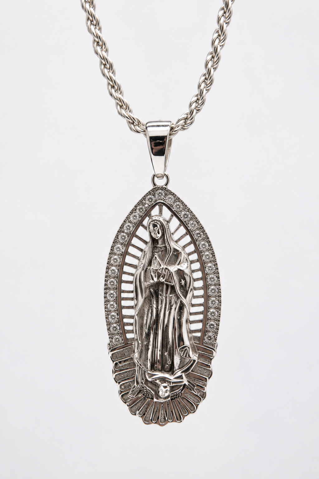 Silver-tone Our Lady of Guadalupe pendant with a decorative border, shown on a rope-style chain.