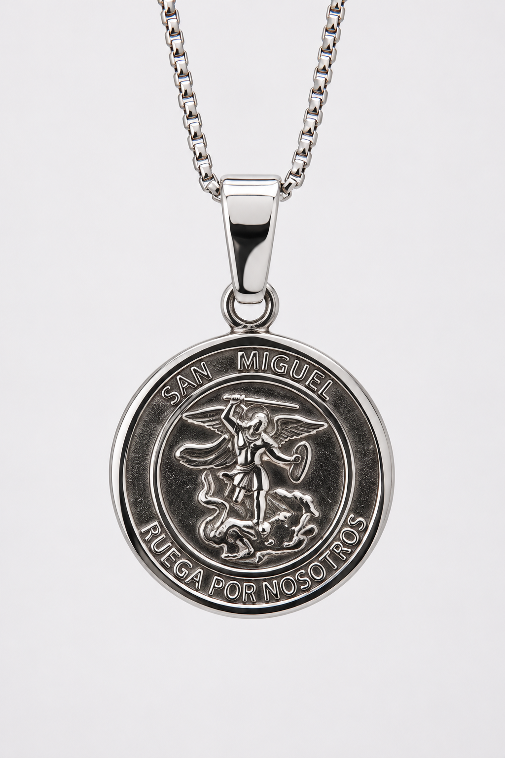 Silver San Miguel Saint Michael round religious medal necklace with the inscription Ruega Por Nosotros.