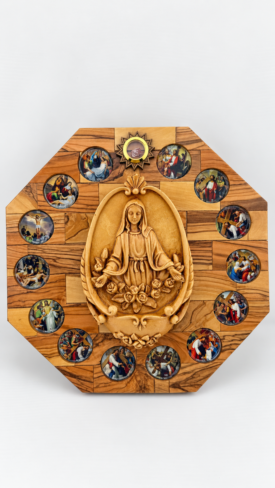 Octagonal olive wood wall plaque with central Virgin Mary relief surrounded by colorful Stations of the Cross scenes